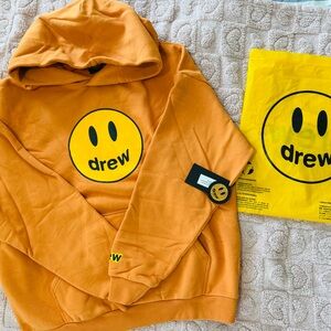 DREW house Hoodie in Vibrant Orange with Smiley Graphic. with tags and dustbag